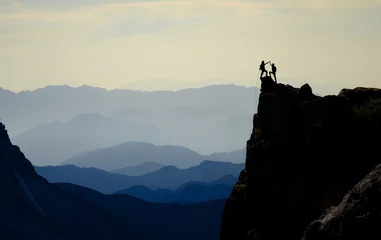 Fotobehang rock climb success and charming mountains © emerald_media