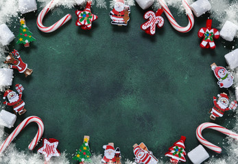 New Year green background with decorative clothespins. Happy New Year and Merry Christmas!