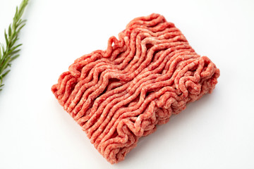 Ground beef and pork with rosemary isolated on white