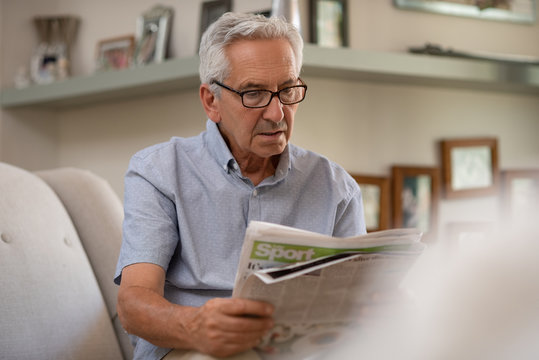 Senior Man Reading Newspaper