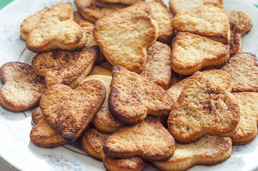 delicious homemade cinnamon cookies in the shape of hearts