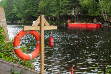 Life buoy station on a construction site which involves the two banks of a river - 2/2 - Wide angle...