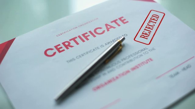 Certificate document rejected, hand stamping seal on official paper, assessment