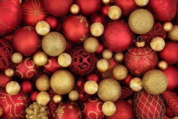 Christmas red and gold bauble decorations forming an abstract background. Traditional christmas...