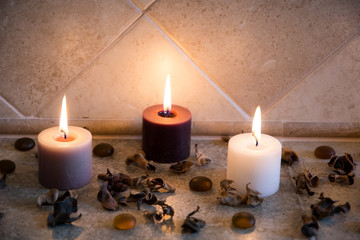 relaxing spa background with candles and some wooden petals