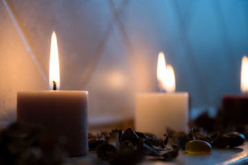 relaxing spa background with candles and some wooden petals