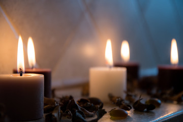 relaxing spa background with candles and some wooden petals