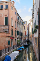 Fototapeta na wymiar Venice, ancient buildings and nobody in the canal, tranquil scene in Italy