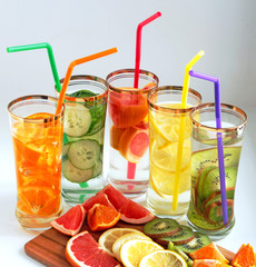 detox water in glasses with straws of various kinds from fruits and vegetables