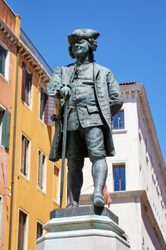 Playwright Carlo Goldoni statue by Antonio Dal Zotto (1841-1918) in Venice in a sunny summer day, Italy