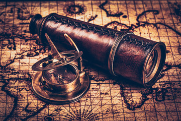 Old vintage compass on ancient map