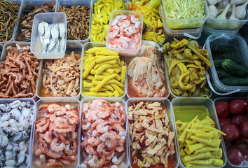 pickled products in trays on the market