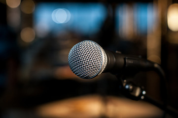 Vocal microphone on the background of colorful light