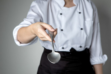 chef hand spoon cooking prepare  food  in kitchen restaurant want you to taste delicious