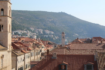 Church tower and terracotta tiled roofs