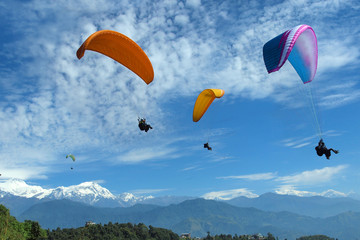 paragliding near Annapurna range  at Pokhara ,Nepal - obrazy, fototapety, plakaty