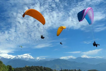 Papier Peint photo Lhotse paragliding near Annapurna range  at Pokhara ,Nepal