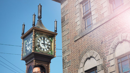 Steam Clock Tower Tower with Bell Tower and blue sky background.