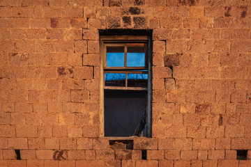 Window in old ruined abandoned house