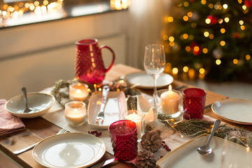 christmas, holidays and eating concept - table served for festive dinner at home