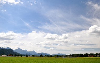Typical Bavarian pieceful landscape, South Bavaria, Germany. Beautiful Alps mountains, hills and...