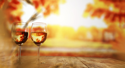 two single glasses of wine wiht free space for your bottle and blurred background. 