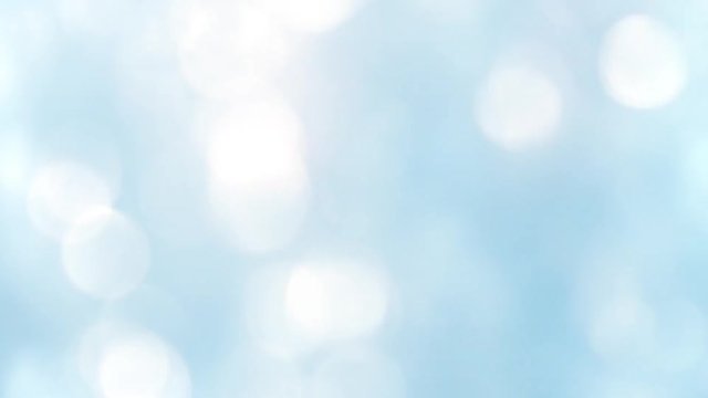 Falling bokeh lights - hypnotic abstract animation for background - discs of light falling down - 60 fps - white lights on a blue background.