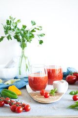 The juice from the tomatoes and peppers on grey background