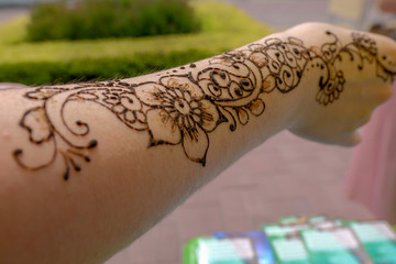 henna drawing closeup on female hand