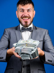 Get cash easy and quickly. Cash transaction business. Man happy winner rich hold pile of dollar...