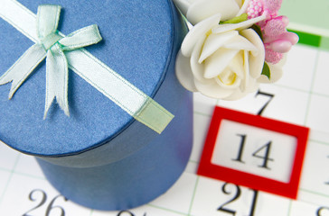 Gift box is on the calendar with the date of February 14.