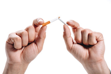 cropped image of man breaking unhealthy cigarette isolated on white