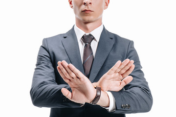 cropped image of businessman in suit showing rejection sign isolated on white