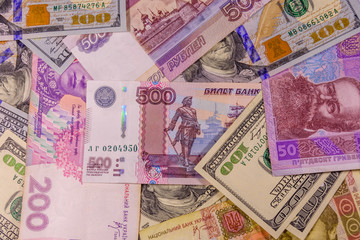 Fototapeta na wymiar Background of the different american, ukrainian and russian banknotes