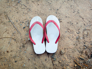slippers on the beach