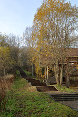 Long narrow outdoor staircase in a deserted autumn park
