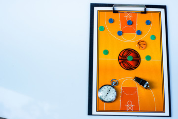 Clipboard with basketball field, coach whistle, chips and stopwatch on white background. Sport mockup basketball template for team or coach. Top view