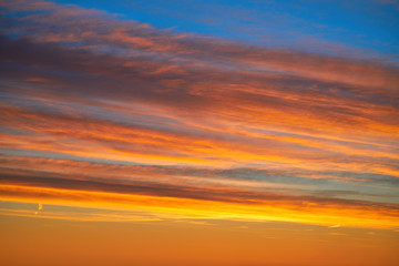 Sunset clouds sky in orange and blue