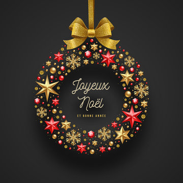 Joyeux noël - Christmas greetings in French. Frame in the form of Christmas wreath - made from stars, ruby gems golden snowflakes, beads and glitter gold bow ribbon.