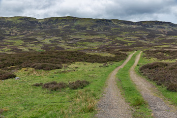 Unpaved country road in Scottish Highlands near Loch Tay and Ben Lawers