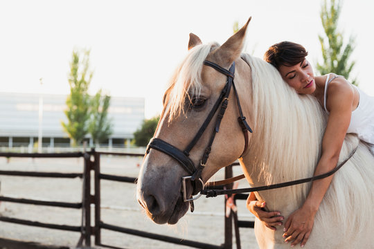 Portrait of woman relaxing on riding horse