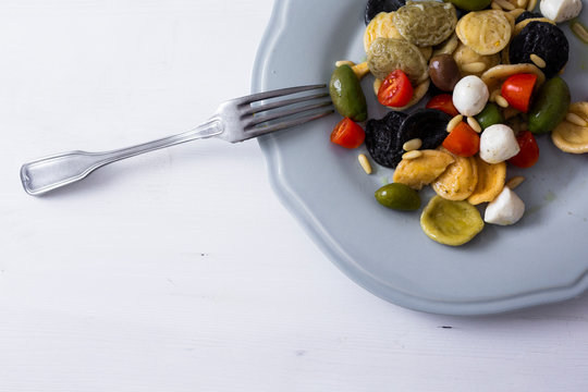 Mediterranean orecchiette with tomato, olives, mozzarella