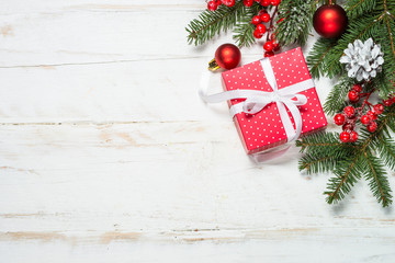 Fototapeta na wymiar Christmas background with fir tree, present box and decorations 