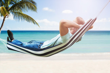 Man Relaxing In Hammock