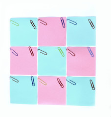 multiple blank sheets for notes with paper clips isolated on whi