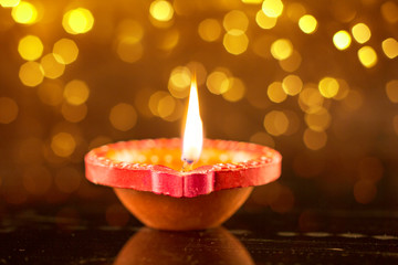 Happy Diwali Clay Diya lamps lit during Dipavali Hindu festival of lights celebration - obrazy, fototapety, plakaty