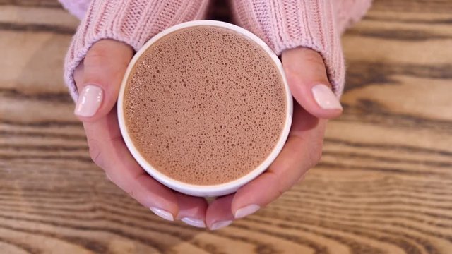 Hot Chocolate In Woman Hand Wearing Knit Sweater