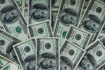 Background for the design of a lot of money. Many banknotes laid out on the table. More than two thousand dollars laid out as a background for design.