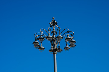 Fototapeta na wymiar Old street lamp at Bolshoi Theater Square (Teatralnaya Ploschad). Moscow, Russia