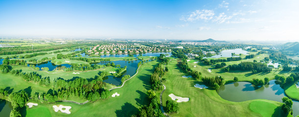 Aerial photograph of forest and golf course